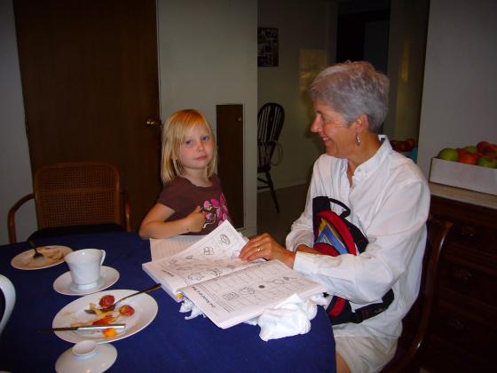 Sophie showing Molly her workbook